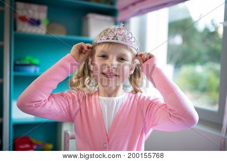 Portrait of cute girl wearing a tiera