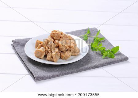 plate of soy meat cubes on grey place mat