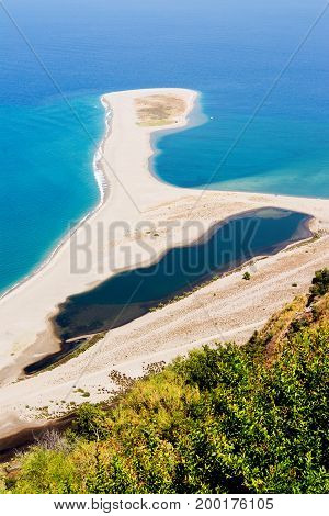 view of tindari beach in sicily, white sand