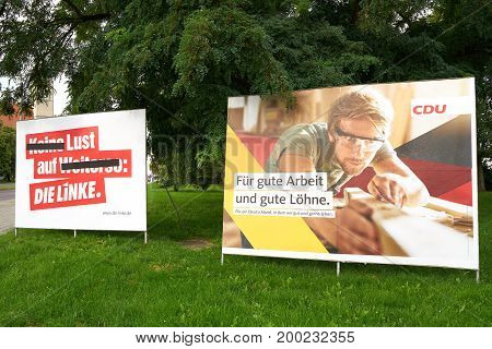 MAGDEBURG, GERMANY - AUGUST 18, 2017: Election campaign posters of different parties, for the Bundestag election on 24 September 2017 in the city center of Magdeburg