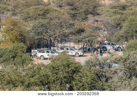ETOSHA NATIONAL PARK NAMIBIA - JUNE 24 2017: Camping sites in the Okaukeujo Rest Camp in the Etosha National Park as seen from the watchtower