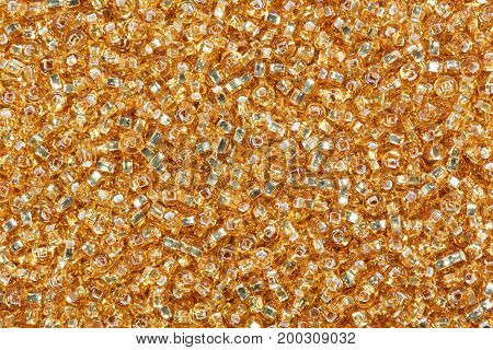 Yellow corn seed beads background. High resolution photo.
