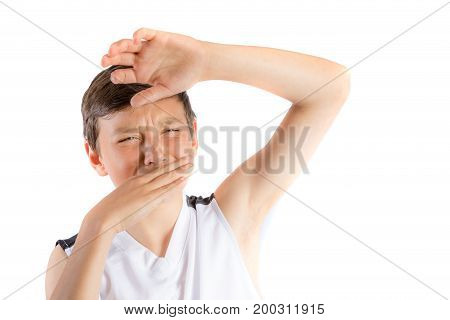Young teenage boy isolated on a white background with smelly armpit