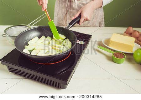 House Wife Wearing Apron Making. Steps Of Making Cooking Apple Cake. Cutting Green Apple.