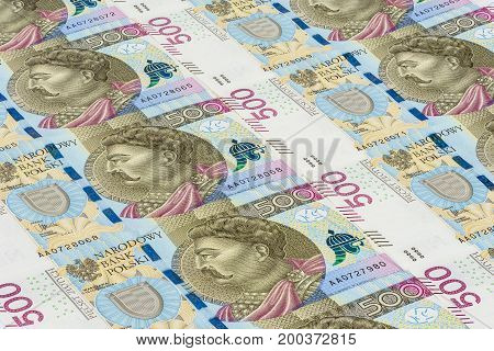 Background made of 500 pln banknotes laying in a row