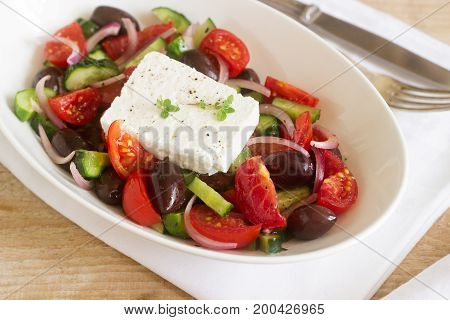 Traditional Greek Salad With Fresh Vegetables, Feta Cheese And Olives.