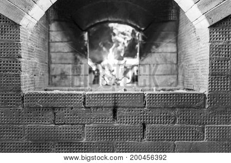 The form for the inscription on the background of the Russian stove and burning it birch firewood.