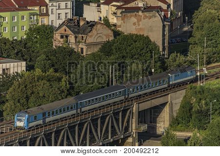 Trains on bridge over Labe in Usti nad Labem in hot summer evening