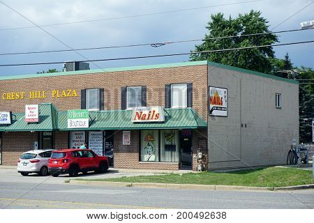 CREST HILL, ILLINOIS / UNITED STATES - JULY 19, 2017: One may have one's nails trimmed at Beautiful Nails, or purchase gifts and view the Rock and Mineral Show at O'Bryant's Boutique, in the Crest Hill Plaza on Plainfield Road.