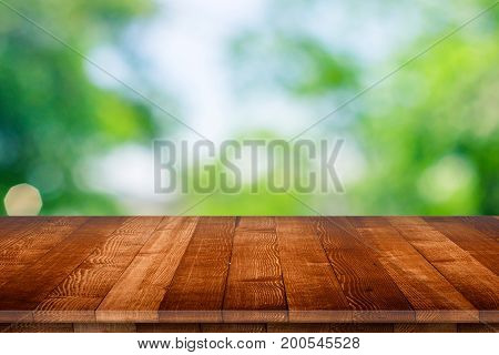 Empty wooden table for product placement or montage with focus to table top in the foreground, with white background. Wooden board empty table perspective.