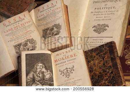 Copenhagen, August 14, 2010: Pile of vintage, antiquarian books with frontispiece illustrations