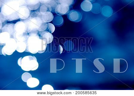 Text Ptsd On A Blue Bokeh Abstract Light Background
