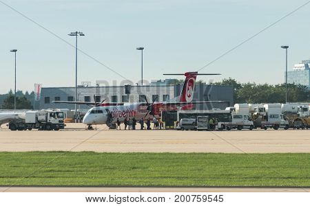 Stuttgart, Germany - August 17, 2017: A plane by the bankrupt German airline AirBerlin has landed and is embarking at the airport of Stuttgart, Germany.