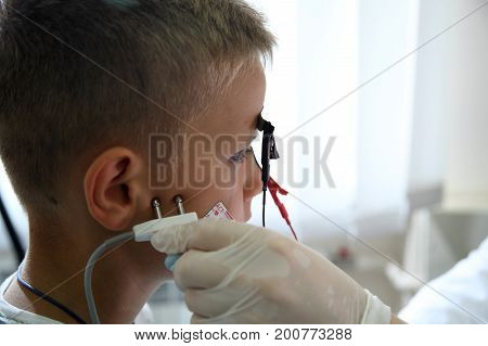 VINNITSA, UKRAINE, JULY 27, 2017: A new direction in medicine is electroneuromyography. Medical examination ELECTROMYOGRAPHY.