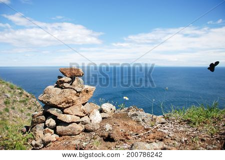 A pile of stones against the sea