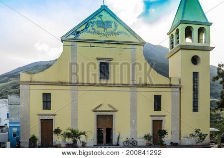 Close-up of the church of san vicenzo that covers the top of the volcano stromboli and fumes emitted by the same stromboli island italy