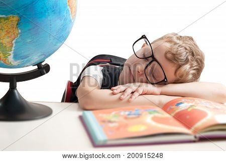 A Child Of Primary School Age Are Sleeping At The Desk