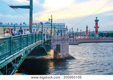 Sankt-Peterburg, Russia - August, 19, 2017: Neva embankment with Rostral Columns and Dvorcoviy bridge in Sankt-peterburg