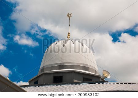 The Dome Of The Main Mosque On The Blue Sky Background. Miri City, Borneo, Sarawak, Malaysia