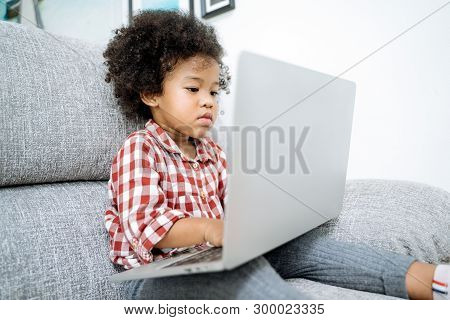 Little Girl With Laptop .afircan Kid Using Laptop