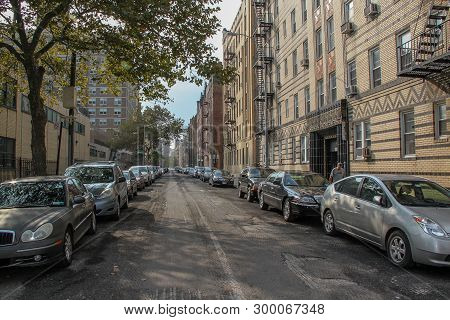 Beautiful Landscape View Of One Of One Of Streets In Brighton Beach Neighborhood. Yellow Buildnings 