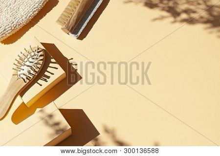 Bathroom, Spa Accessories Concept Flat Lay On The Beige Background. Top View Frame With Hairbrush , 