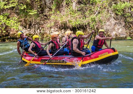 Adventure Team Doing Rafting On The Cold Waters Of The Nestos River