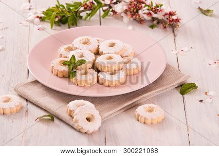 Canestrelli Biscuits With Mint On Wooden Table.