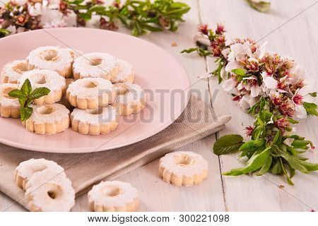 Canestrelli Biscuits With Mint On Wooden Table.