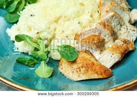 White Rice With Chicken Breast. Rizotto. Gray Light Textured Background. Beautiful Serving Of Dishes