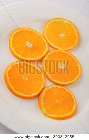 Fresh Slised Oranges Isolated On The Gray Background