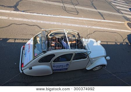 Paris, France-may 06, 2018: Iconic Citroen 2cv For Rent. Vintage French Car With Driver Is A Very Po