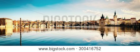 Prague, Charles Bridge Reflected In Vltava River In The Morning, Panorama Image For Your Banner Or W