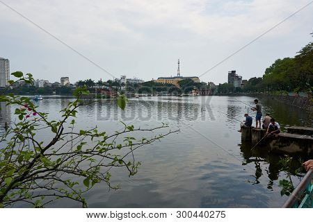 Hanoi, Vietnam - Mai 01, 2019: Fisherman Fishing At Truc Bach Lake. The Capital Of Vietnam