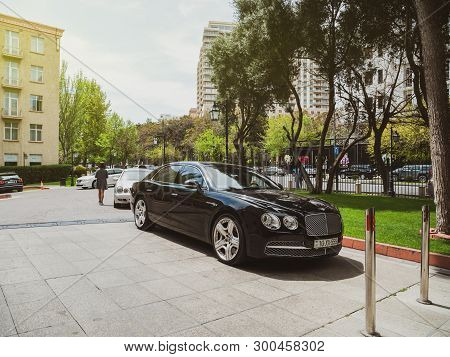 Baku, Azerbaijan - May 2, 2019: Luxury Bentley Black Car Parked In Front Of Hyatt Hotel In Central B
