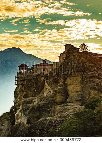 Scenic Sunset Evening Sky Over Holy Varlaam Monastery On Cliff In Meteora, Thessaly Greece. Greek De