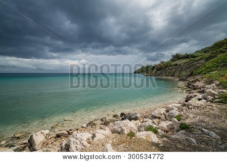 Stormy Dramatic Clouds Accumulating Over Alykes Beach In Zante Island, Greece