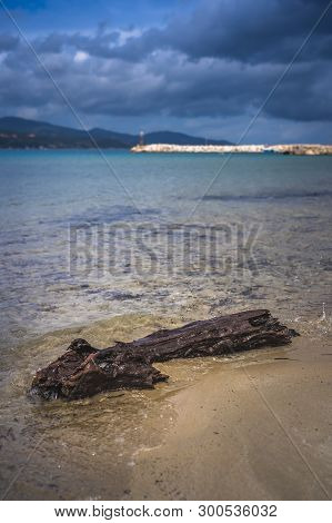 Wet And Submerged Large Piece Of Wood On Alykes Bay In Zante Island, Greece