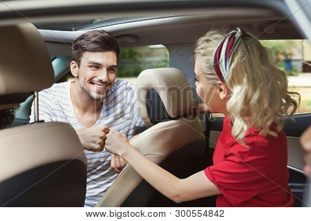 Happy Smiling Friends Traveling By Car, Making Fist Bump