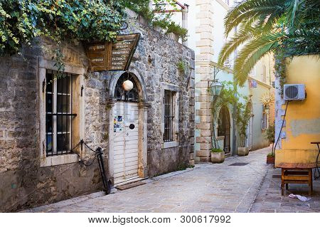 Narrow Street In Budva In Morning. Budva Among Oldest Urban Settlements Of Adriatic Coast, Unesco Wo