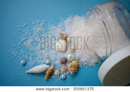 Sea Salt For Exfoliation On Blue Background With Sea Shells