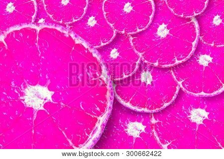 Background Made Of Bright Pink Sliced Tangerines