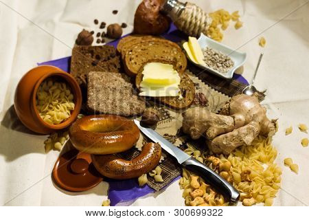 Whole Grain Bread Put On Kitchen Wood Plate. Fresh Bread On Table Close-up. Fresh Bread On The Kitch