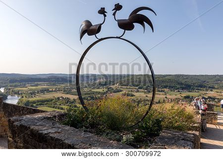 Domme, France - September 2, 2018: Symbolic Roosters And View Of The Dordogne Valley From The Walls 