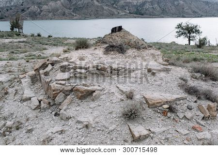 View Opening Onto The Chirkei Reservoir From The Shore. Mountains In The Background Of The Cloudy Sk