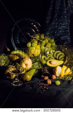 Still Life With Green And Yellow Fruit. Beautiful Fresh Fruits In The Dark