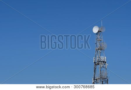 Communication Tower Against A Clear Blue Sky