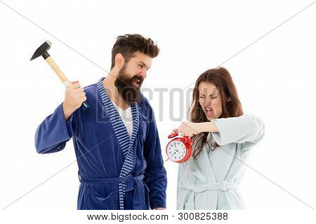 Its Early Time. Sleepy Couple In Love In Morning Time. Angry Hipster And Woman Breaking Alarm Clock 