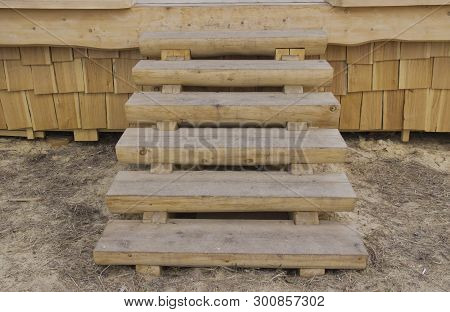 The Wooden Staircase On The Porch Of The Hut