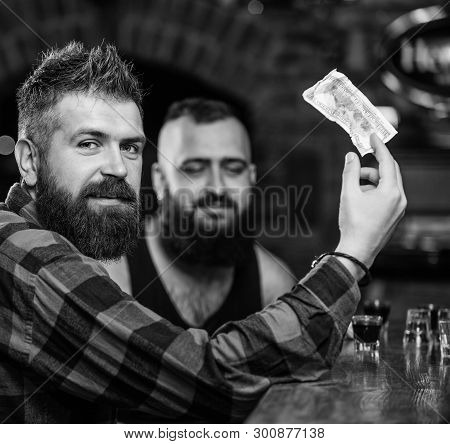 Friends Relaxing In Pub. Hipster Brutal Bearded Man Spend Leisure With Friend At Bar Counter. Order 